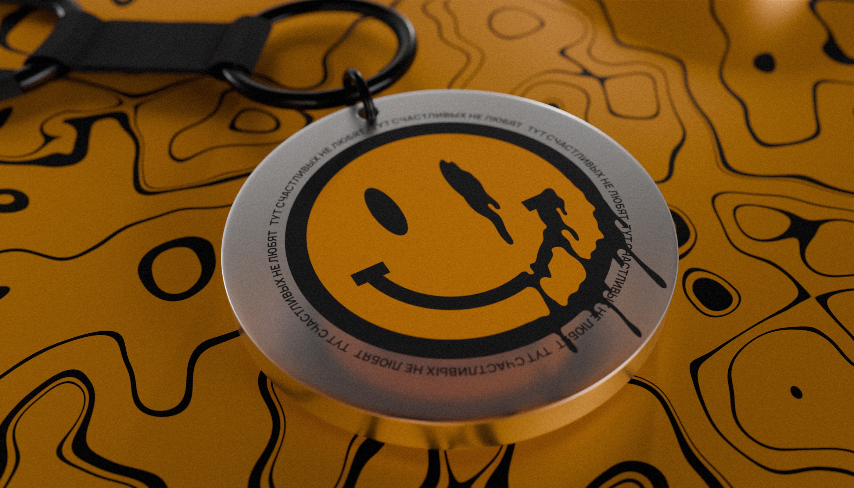 Acrylic keychain close up on an orange and black pattern
