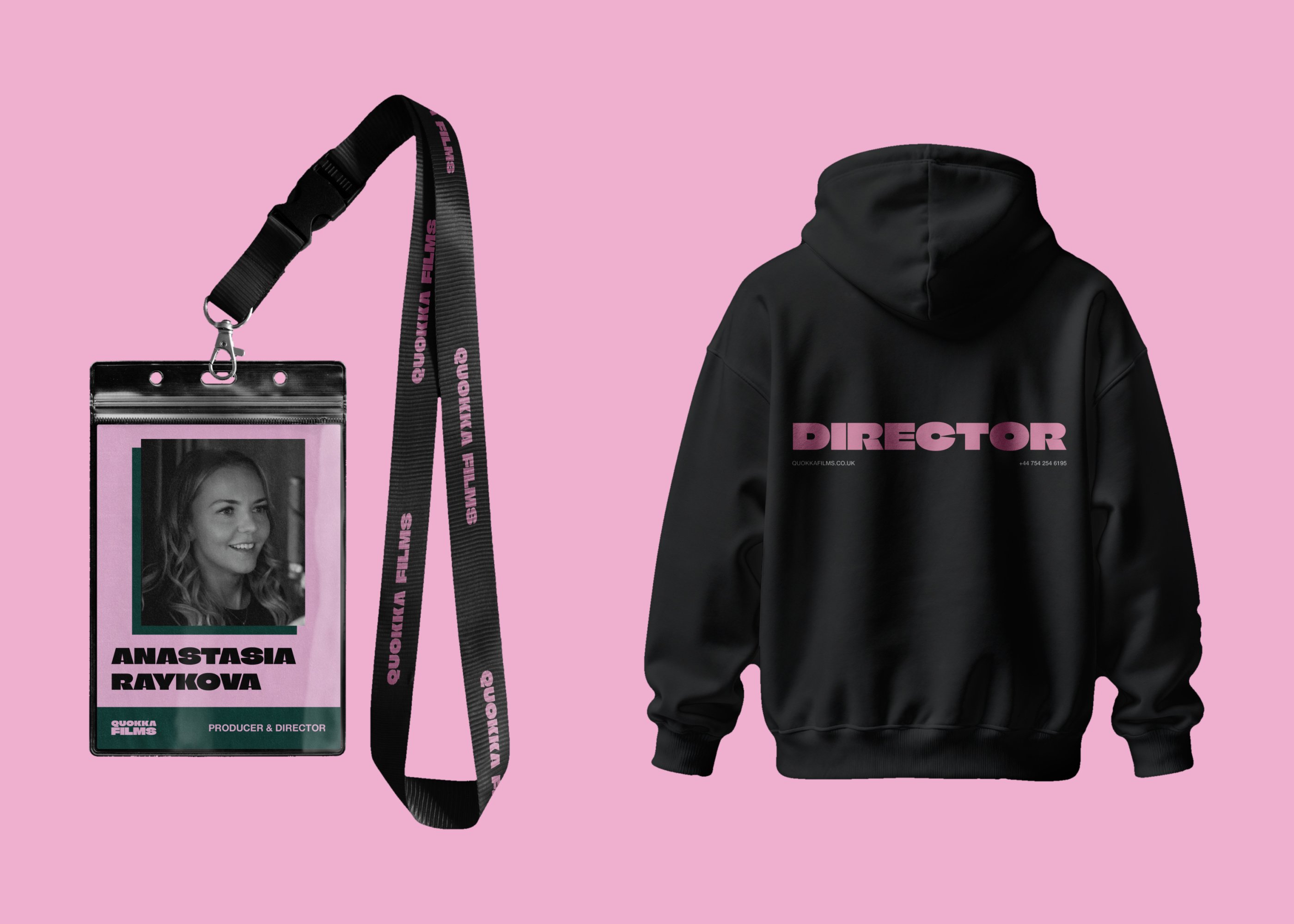 Crew badge on a lanyard and a black DIRECTOR hoodie on a pink background